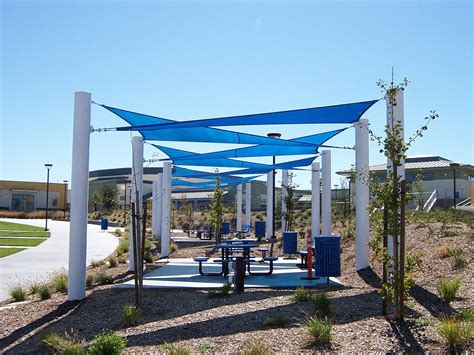 Usa shade and fabric structures - The benefits of USA SHADE commercial shade structures for bus stops are that they: Protect children and families from heat and harmful sun exposure. Keep surfaces of benches cool for travelers. Our fabric shade structures allow air to circulate underneath which keeps shaded areas cooler than solid, non-breathable roof materials.
